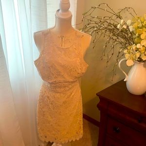 Beautiful cream colored crochet mini dress with lining.